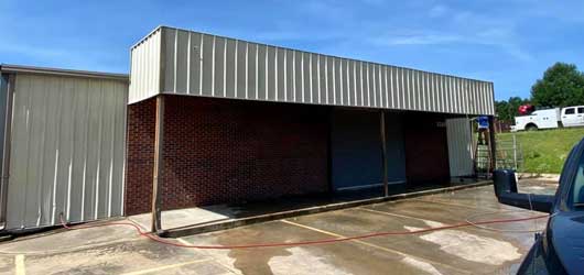 Pressure washing commercial building